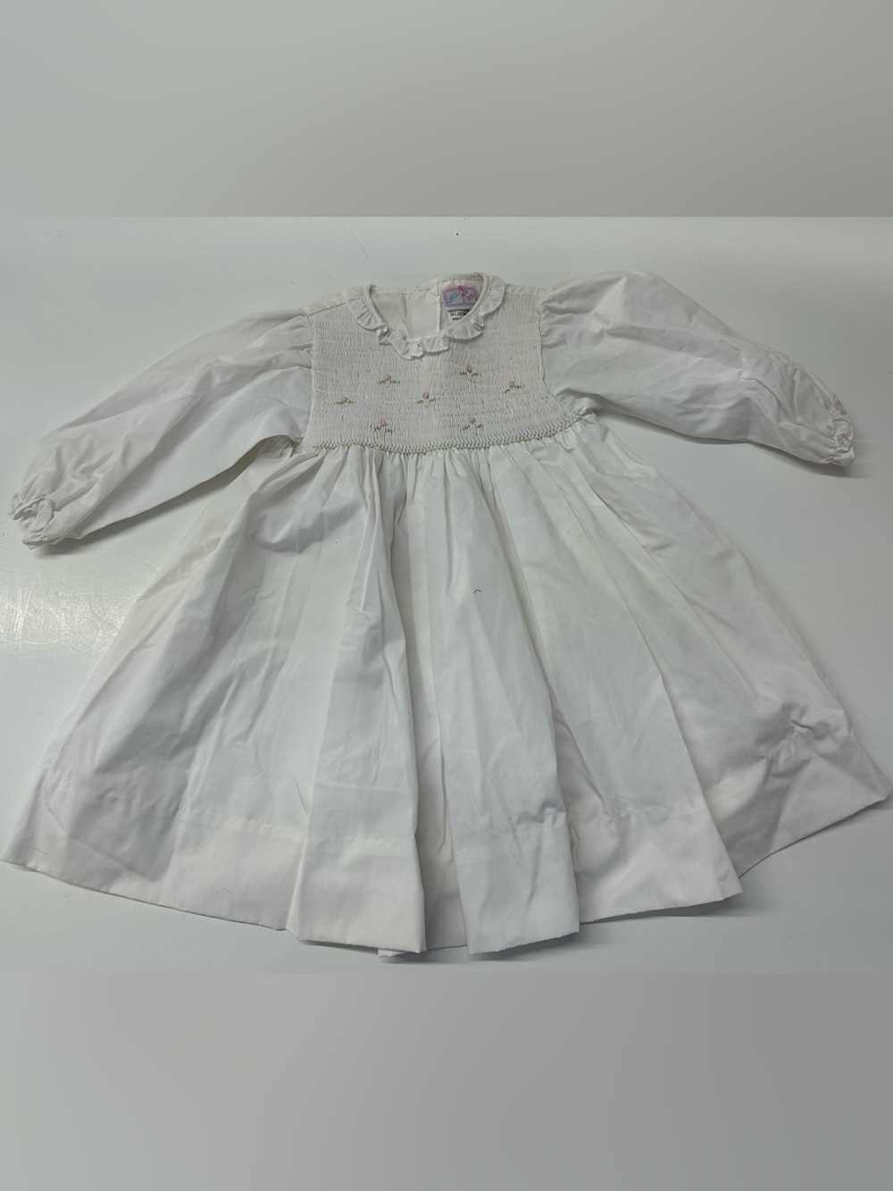 Petit Ami White Long Sleeved Smocked Dress